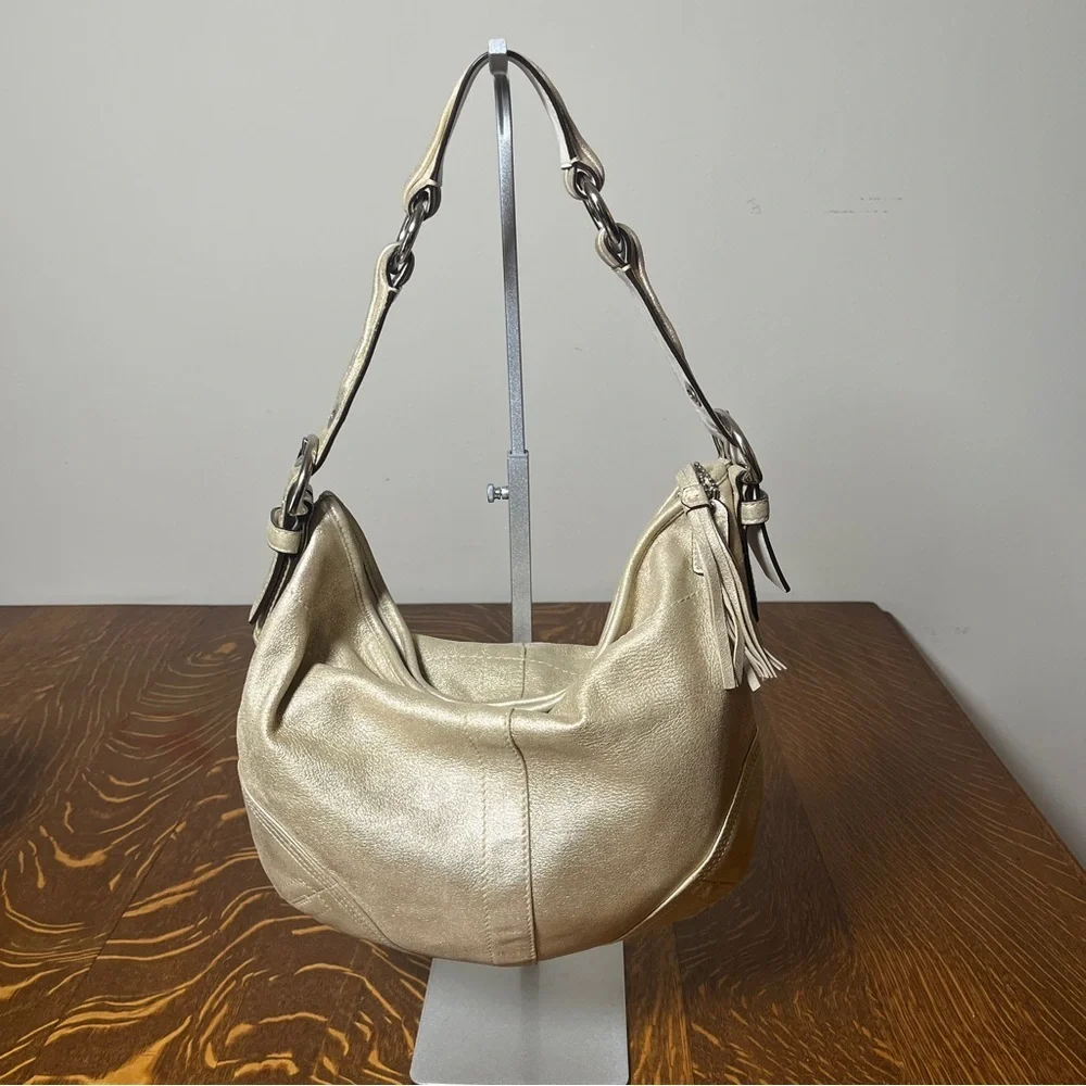 Coach Gold GOAT Leather Hobo Bag with gold tassel